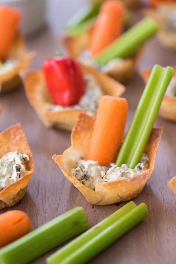 Veggie & Dip Wonton Cups - A veggie and dip tray, in adorable personal-sized portions! Edible wonton wrapper cups are filled with creamy dip and topped with fresh veggies. | foxeslovelemons.com