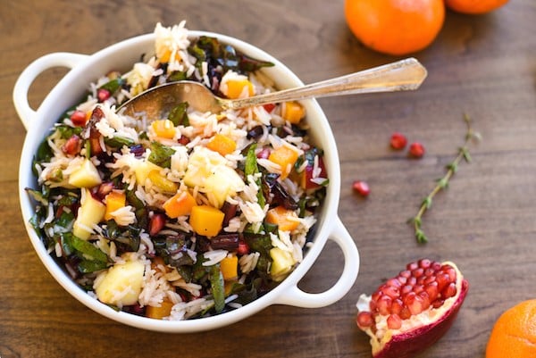 Autumn Celebration Rice Salad - A gluten-free and vegetarian holiday side dish option, loaded with butternut squash, pomegranate, swiss chard, dried cranberries, apples and pistachios, tossed with homemade apple cider vinaigrette! | foxeslovelemons.com