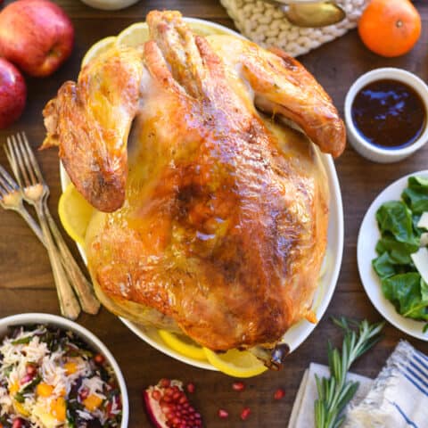Roasted Turkey with Bourbon Apricot Glaze - Jazz up a classic roasted turkey with this simple glaze that gets brushed on when the bird comes out of the oven! | foxeslovelemons.com