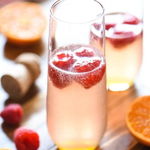 Clementine & Raspberry Rosé Fizz - A sweet and fun bubbly cocktail perfect for brunch! | foxeslovelemons.com
