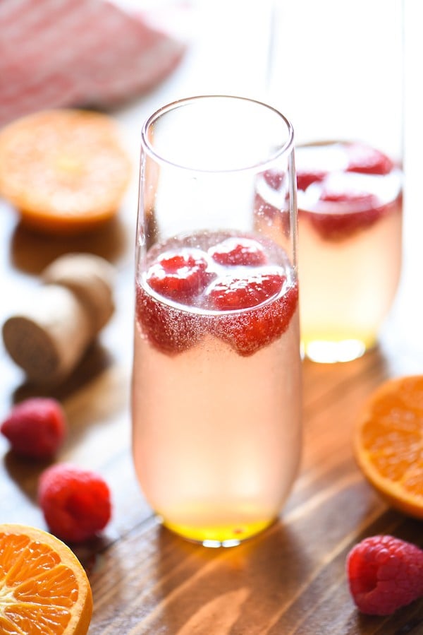 Clementine & Raspberry Rosé Fizz - A sweet and fun bubbly cocktail perfect for brunch! | foxeslovelemons.com