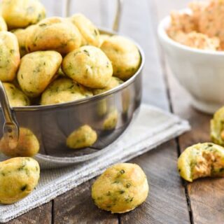 Herb Gougères with Pimento Cheese - An addictively pop-able little party bite! Flaky, herb-flecked dough puffs are filled with creamy pimento cheese dip. | foxeslovelemons.com