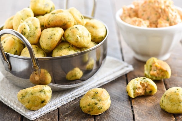 Herb Gougères with Pimento Cheese - An addictively pop-able little party bite! Flaky, herb-flecked dough puffs are filled with creamy pimento cheese dip. | foxeslovelemons.com 