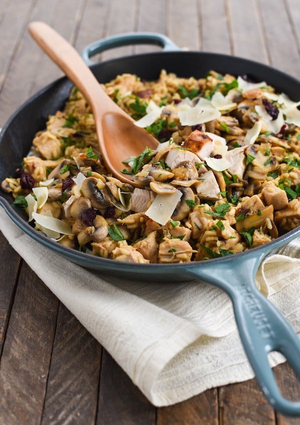 Turkey, Mushroom & Cranberry Risotto - Pure winter comfort food in a skillet. Arborio rice, sautéed mushrooms, turkey breast, dried cranberries and Parmesan cheese come together in this creamy, dreamy rice dish. | foxeslovelemons.com