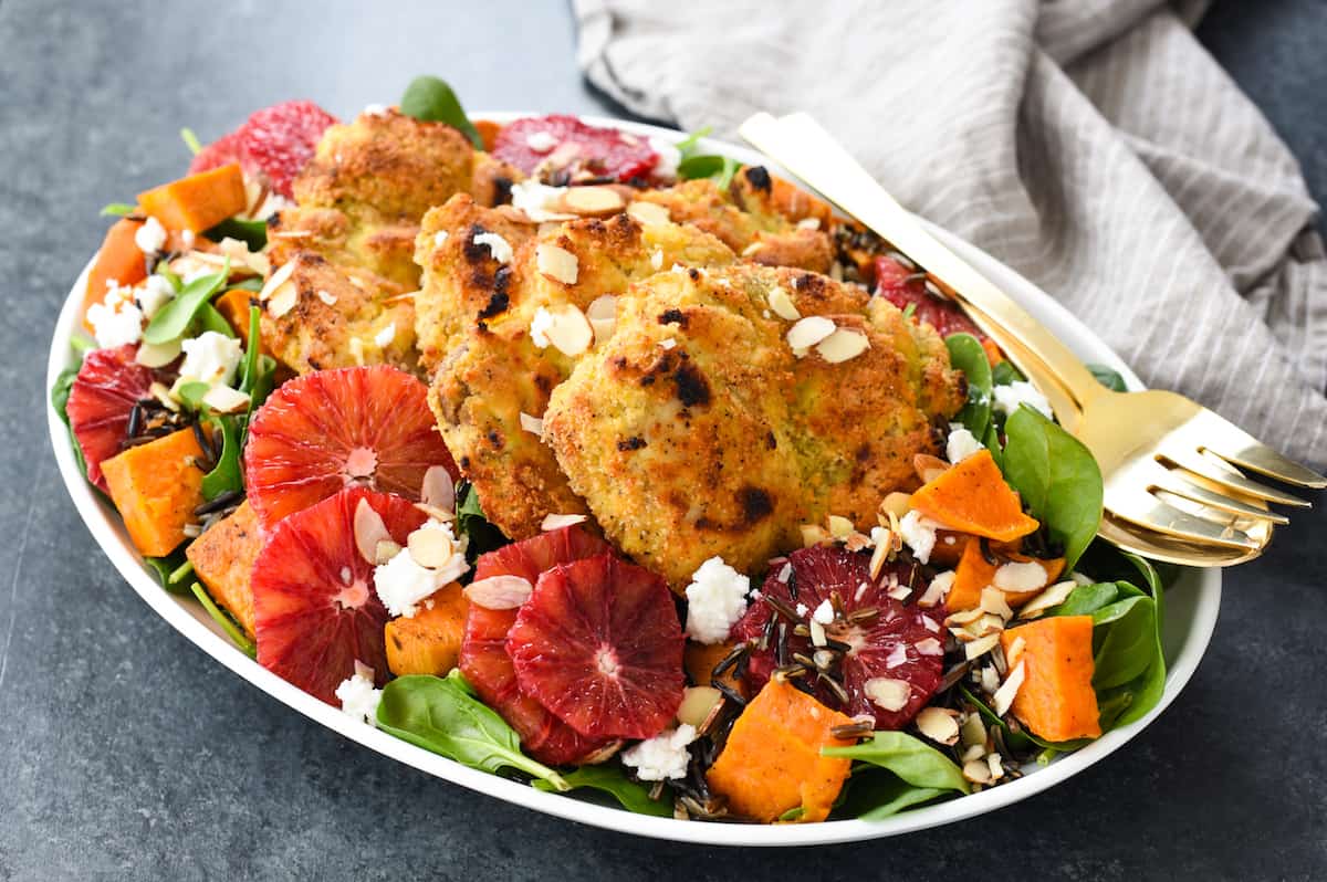 Almond-Crusted Chicken Thighs with Winter Wild Rice Salad - A big platter of winter comfort food masquerading as a salad. Feast your eyes, and your tastebuds, on this healthful, beautiful meal. | foxeslovelemons.com