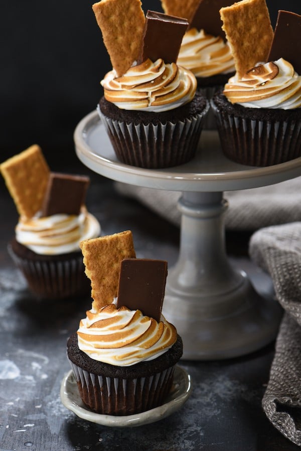 S'mores Cupcakes - These sweet treats have a triple dose of marshmallow flavor! | foxeslovelemons.com