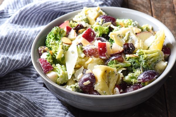 Chopped Broccoli Salad with Cheese Tortellini - A party favorite! Everyone in the crowd will wants seconds of this tortellini salad full of broccoli, cheese, fruit and nuts. | foxeslovelemons.com