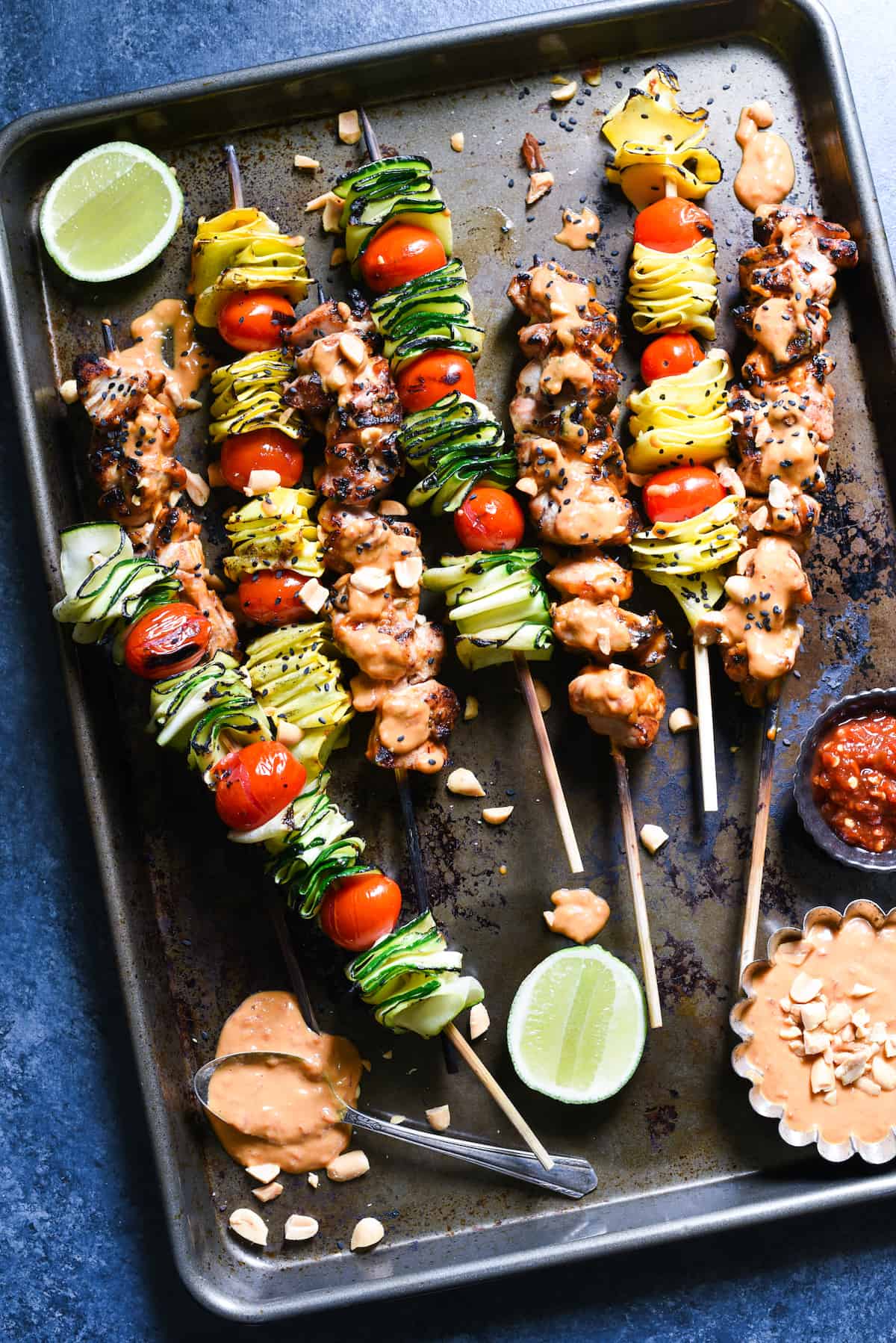 Spicy Peanut Chicken Skewers - The whole family will love this easy grilled take on peanut chicken satay. Serve with veggie skewers for a complete meal! | foxeslovelemons.com