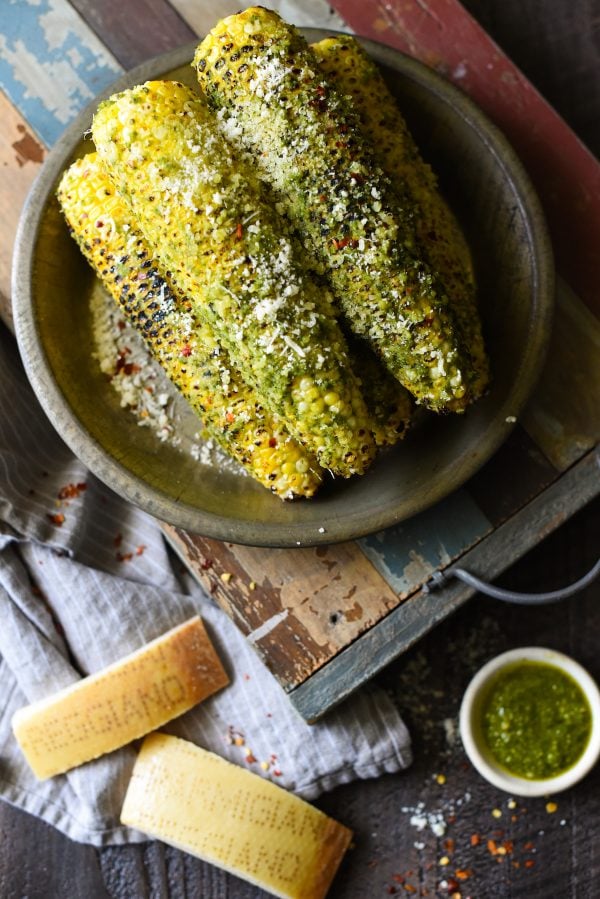 Grilled Parmesan-Pesto Sweet Corn - 4 ingredients. 8 minutes cook time. The best summer side dish ever! | foxeslovelemons.com