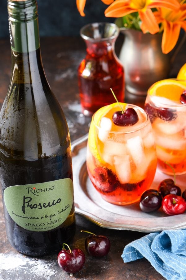 Cherry & Ginger Prosecco Spritz - Stir together this light and refreshing summer cocktail in just 5 minutes! Perfect for a party, or just one! | foxeslovelemons.com