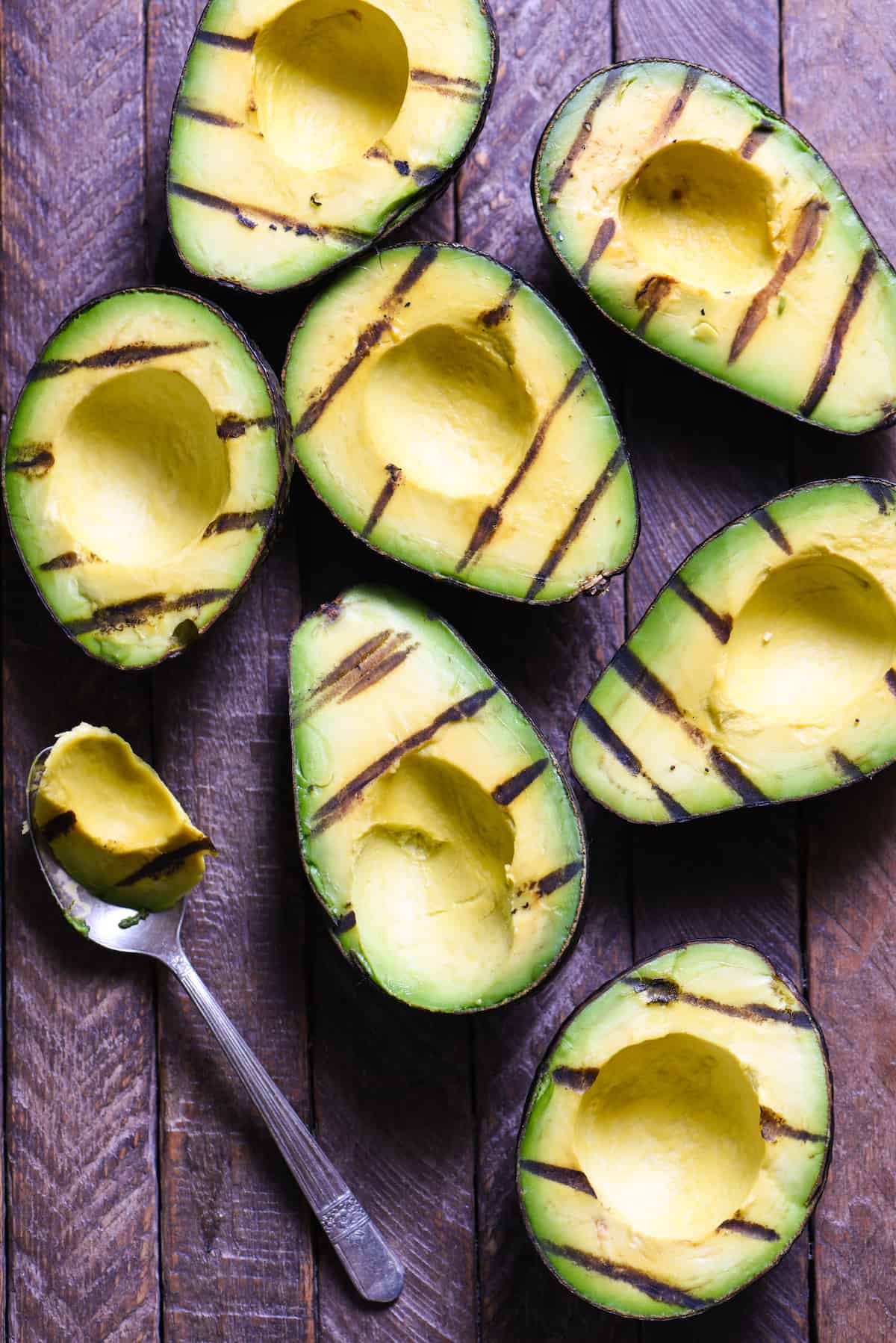 Grilled Avocado Crostini Board - A fun party idea! Pile a bunch of fresh toppings onto a big platter, and let your guests assemble their own grilled avocado crostini! | foxeslovelemons.com