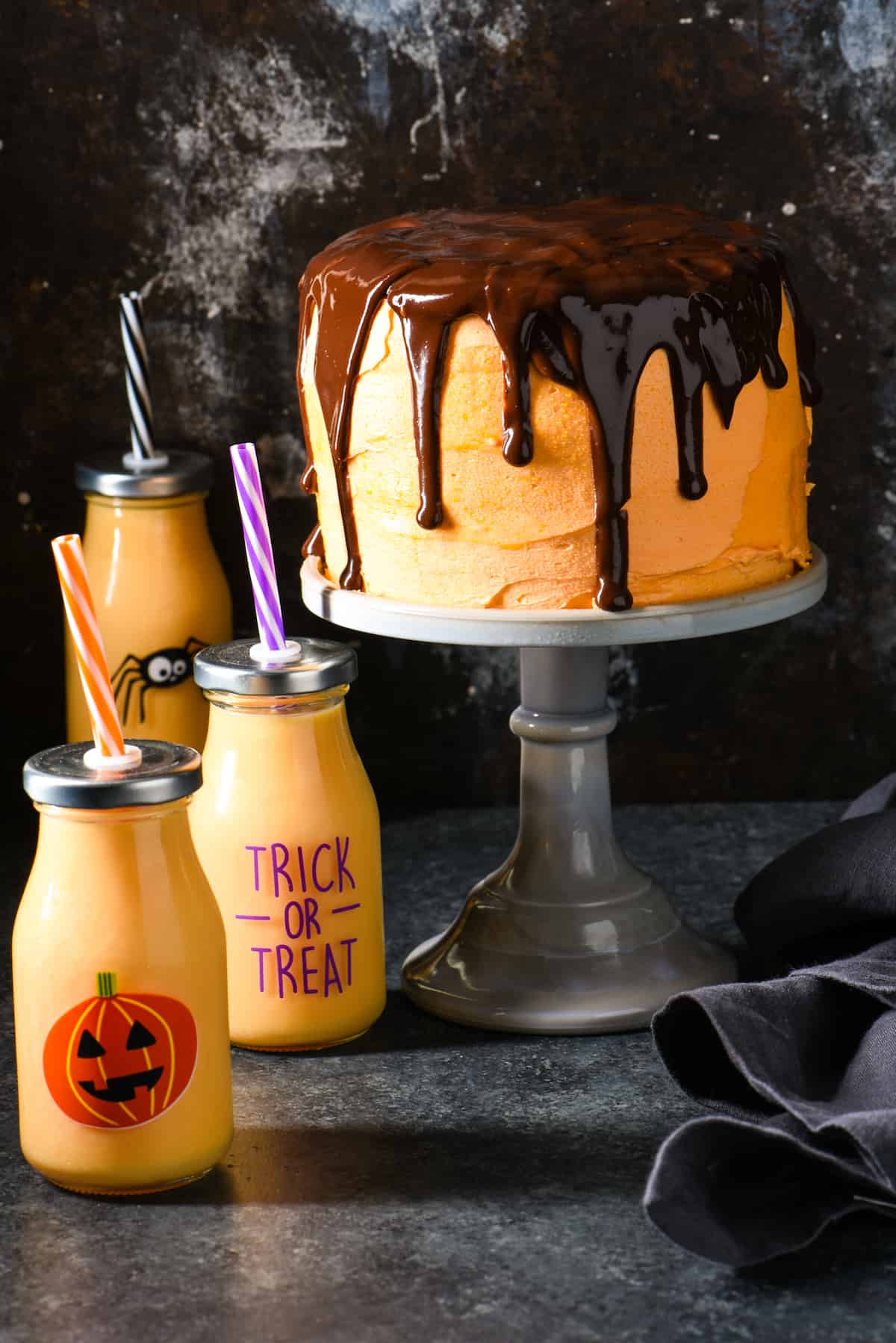 Orange Cream Cake with Chocolate Ganache - Spook your family and friends with this decadent five-layer drip cake. | foxeslovelemons.com