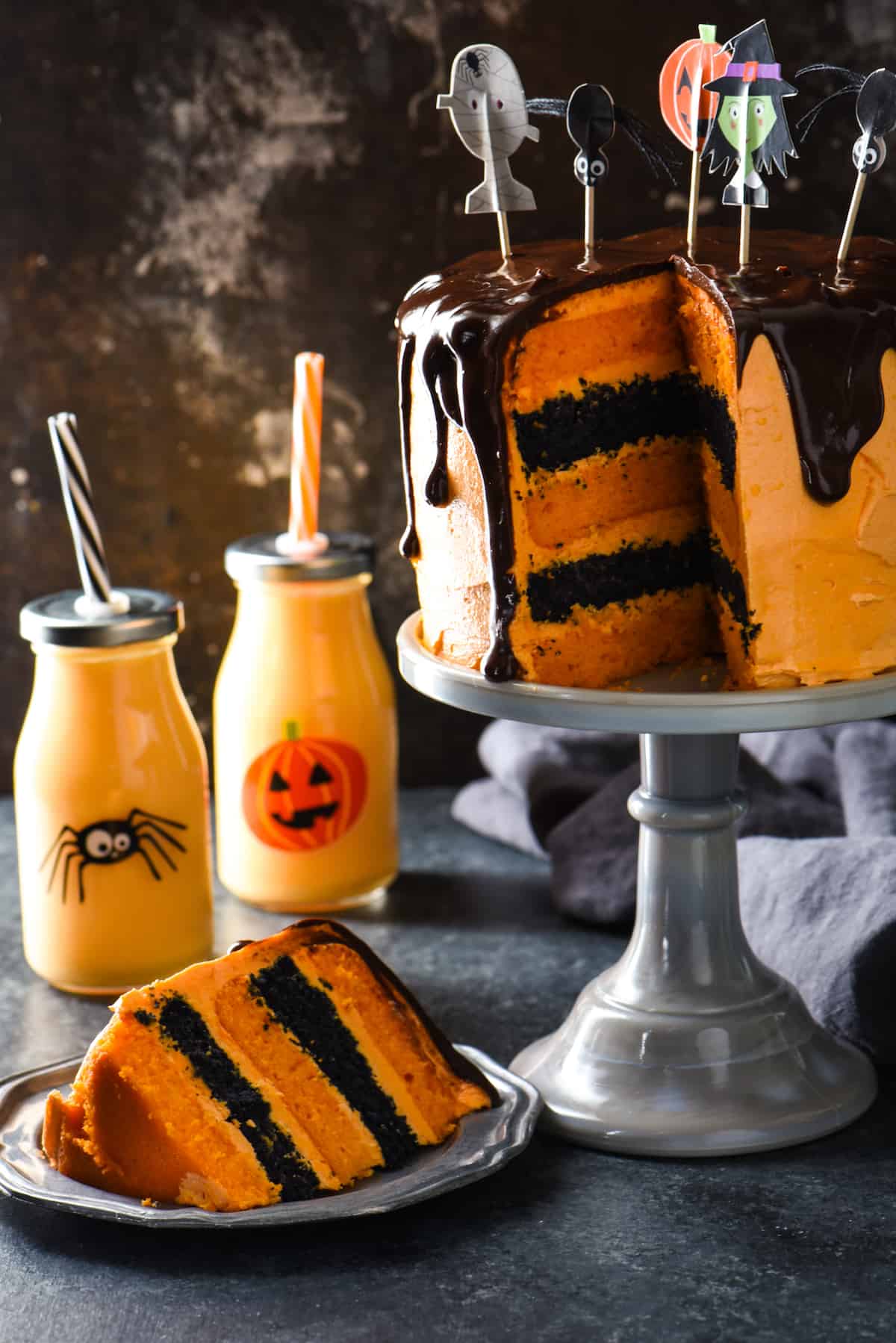 Orange Cream Cake with Chocolate Ganache - Spook your family and friends with this decadent five-layer drip cake. | foxeslovelemons.com