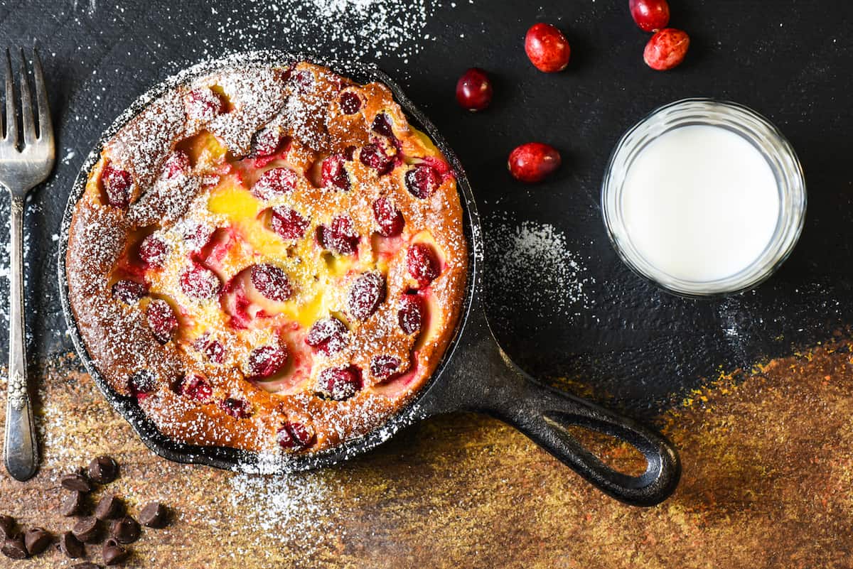 Cranberry Chocolate Chip Clafoutis - Impress your family and friends with this fancy-sounding but super easy (you make the batter in a BLENDER!) custard dessert. | foxeslovelemons.com