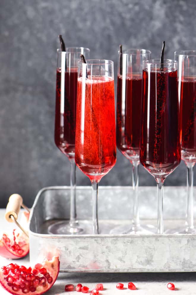 Pomegranate Vanilla Sparking Wine Cocktails - 3 ingredients + 5 minutes = this festive, fruity, bubbly cocktail. Cheers! | foxeslovelemons.com