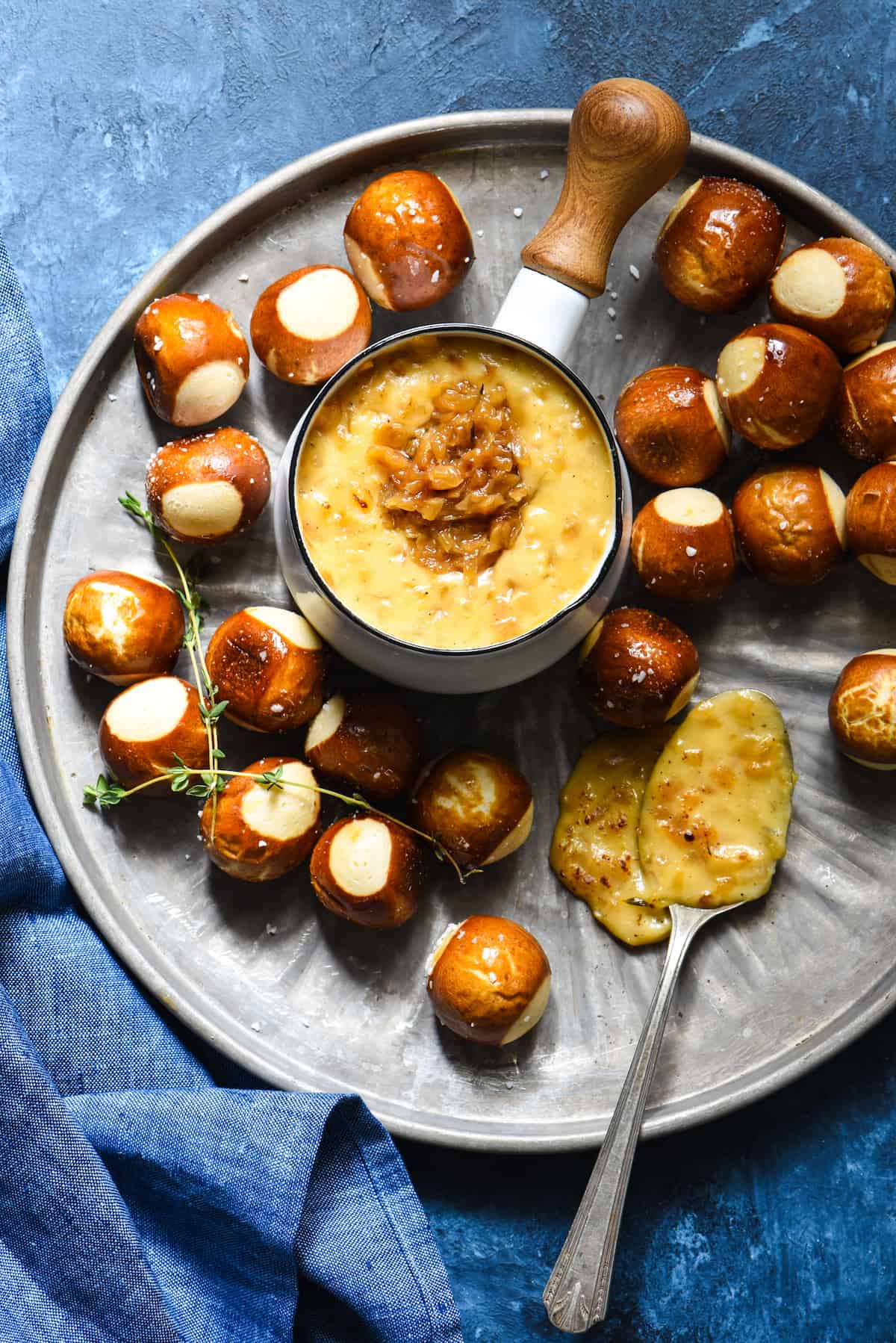 French Onion Cheese Fondue - An ooey gooey three-cheese fondue studded with deeply caramelized onions. | foxeslovelemons.com