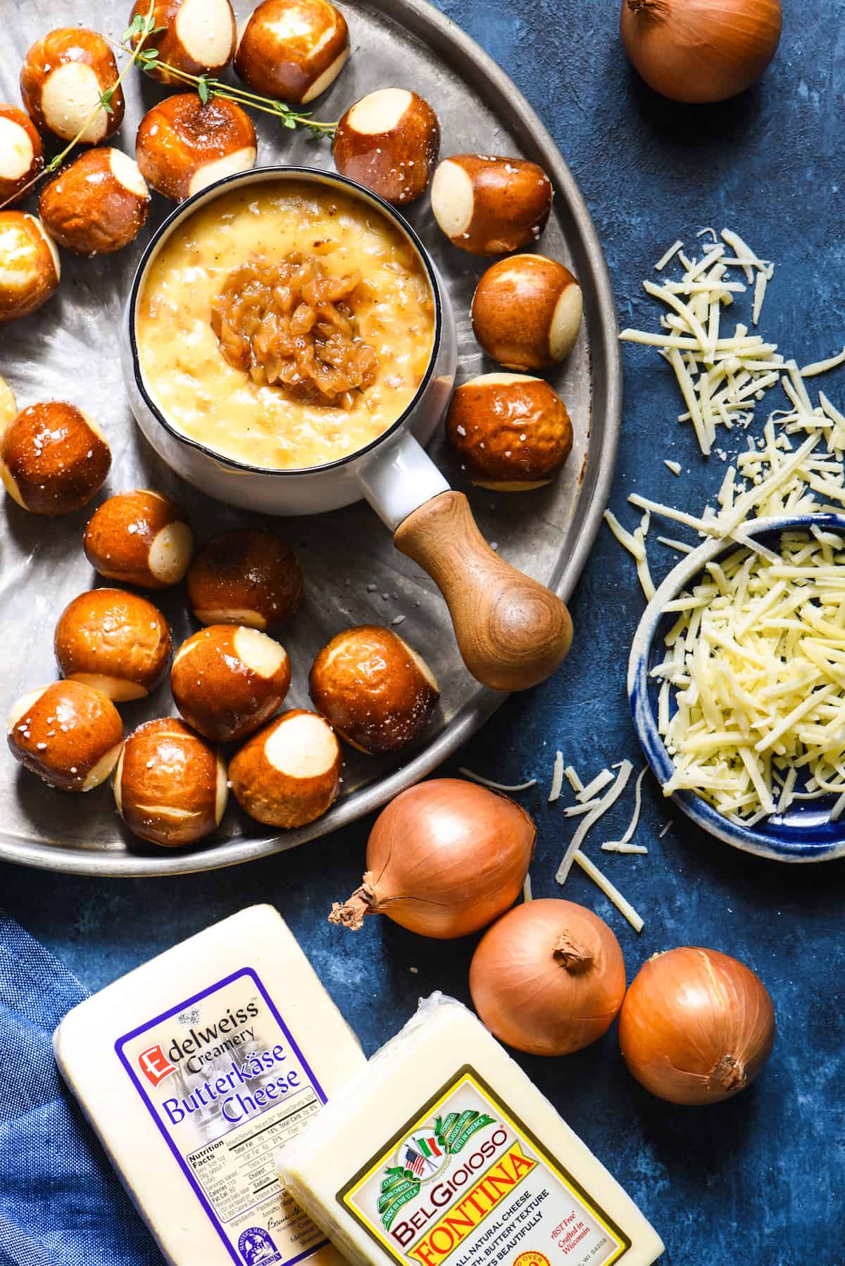 French Onion Cheese Fondue - An ooey gooey three-cheese fondue studded with deeply caramelized onions. | foxeslovelemons.com