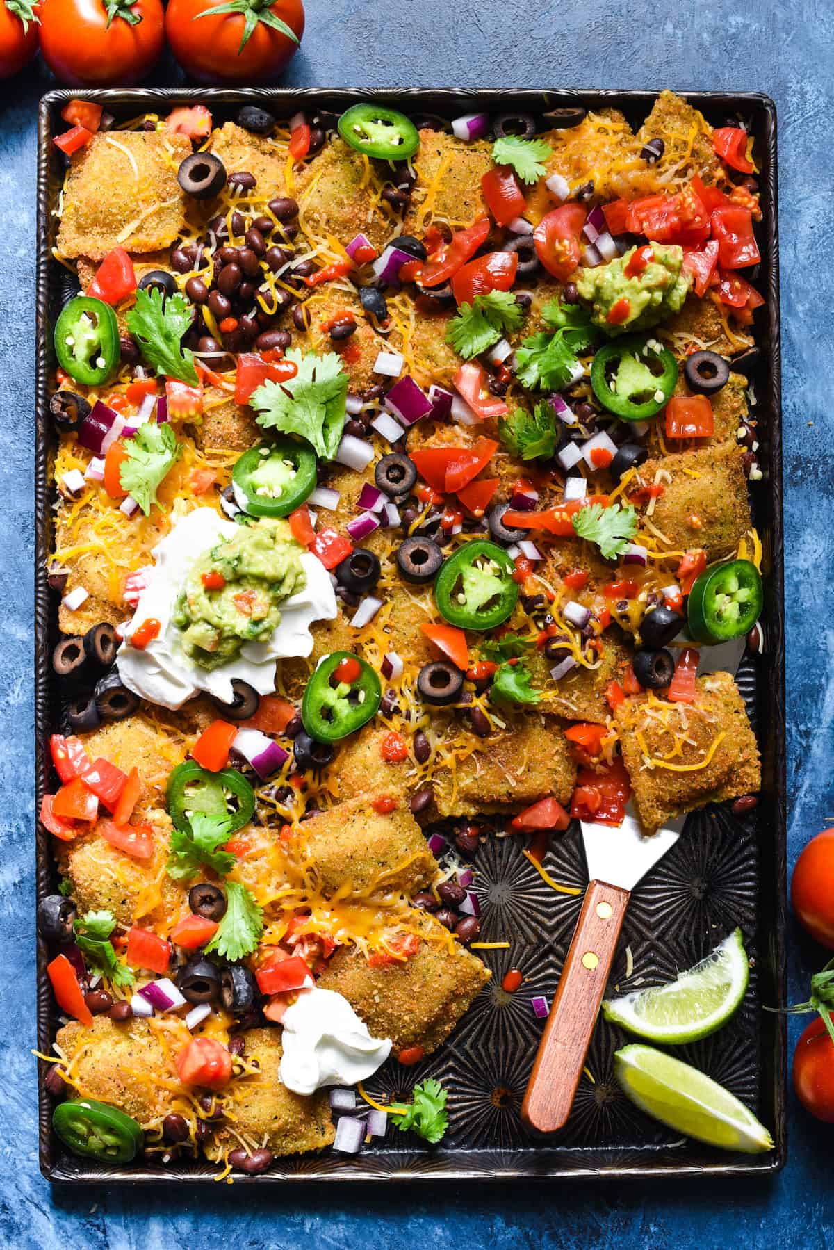 Toasted Ravioli Nachos AKA "Ravilachos" - Use toasted beef ravioli in place of tortilla chips for this crowd-pleasing take on nachos! | foxeslovelemons.com