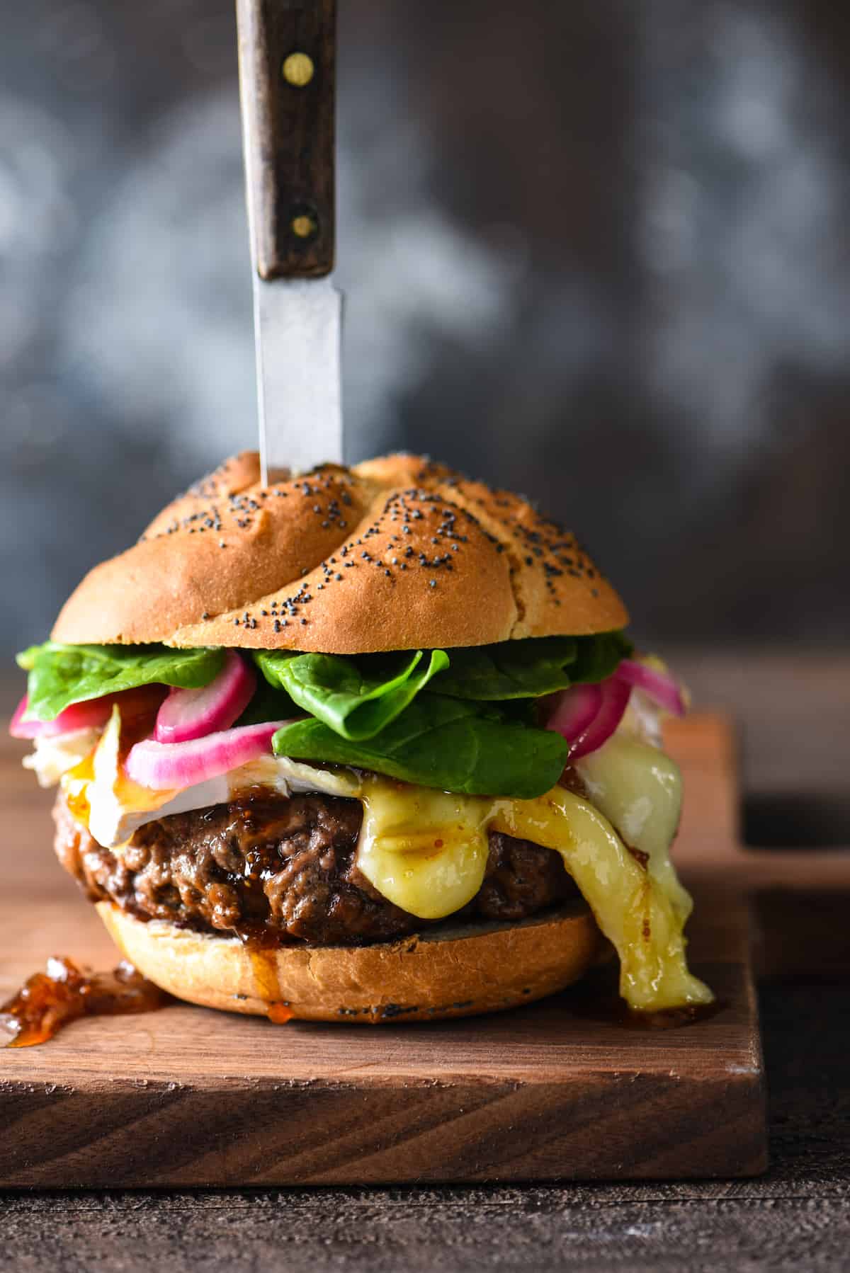 Cheese Board Burger - A big juicy burger piled high with gooey brie, fig preserves and pickled red onions. | foxeslovelemons.com