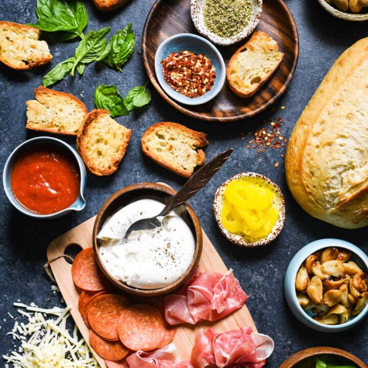 Pizza Crostini Bar - Put out some toasted bread and a big spread of pizza toppings, and let everybody make their own appetizer. So fun for parties! | foxeslovelemons.com