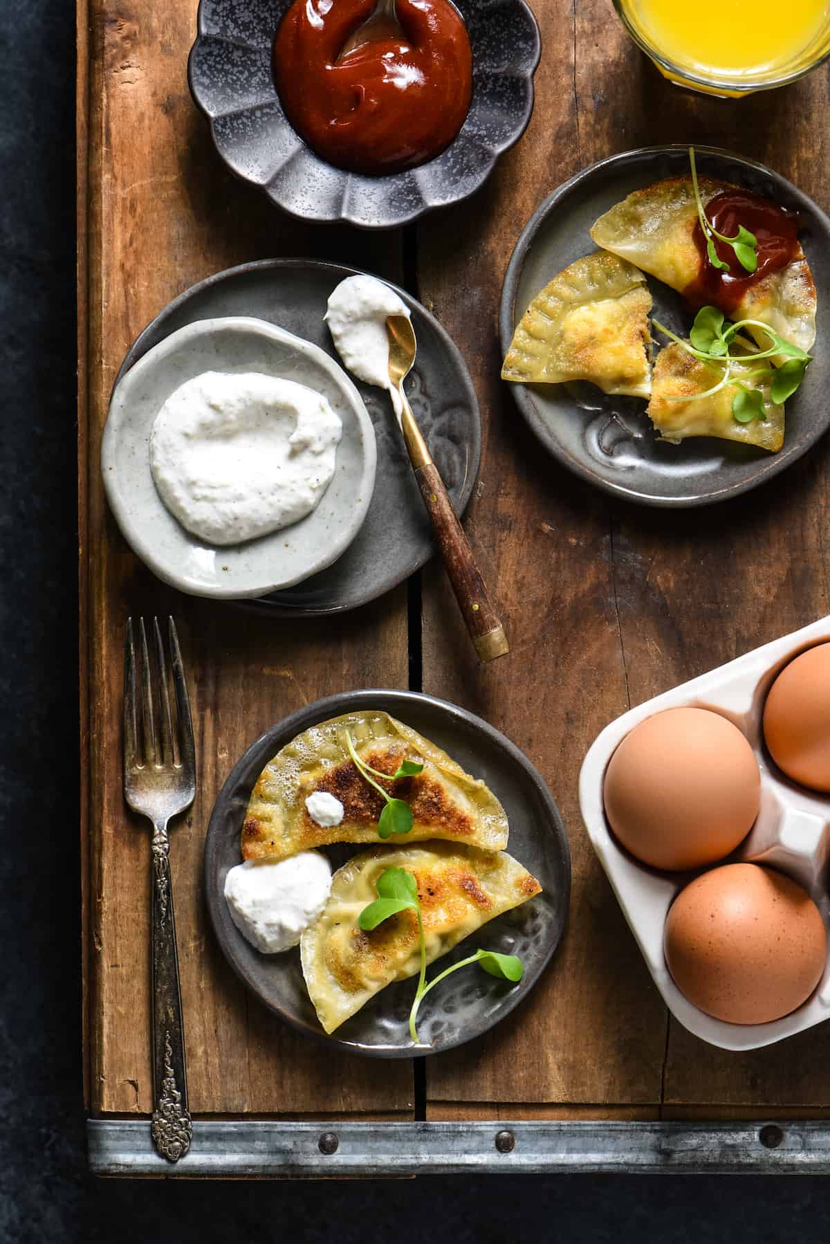 Lazy Sunday Breakfast Dumplings - Make brunch fun again with these sausage, egg and cheese wontons served with two easy dipping sauces. | foxeslovelemons.com