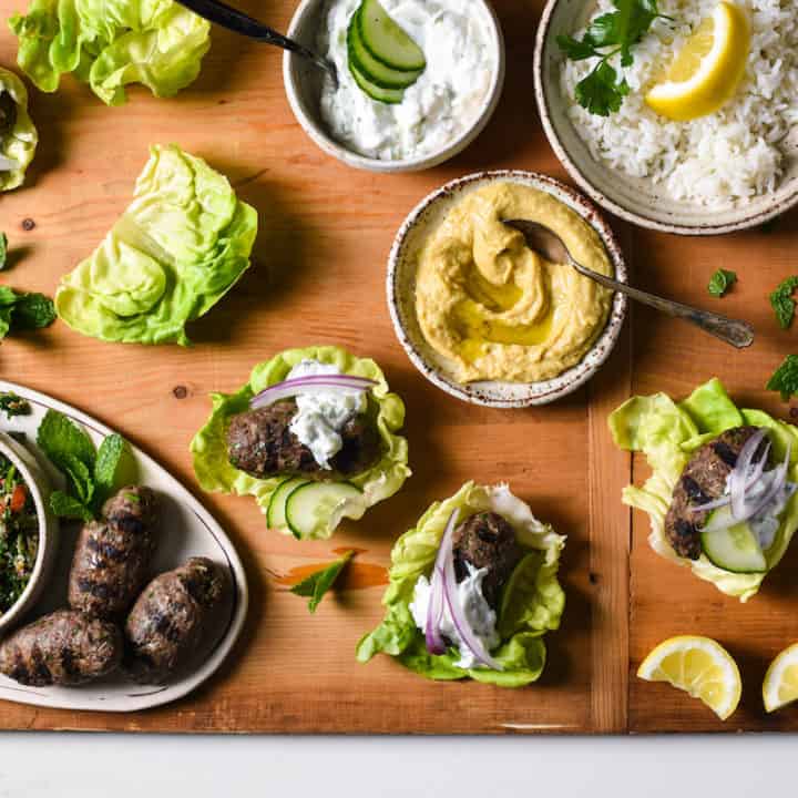 Grilled Kafta Lettuce Wraps - Spiced lamb and beef patties are wrapped in cooling butter lettuce leaves for a fresh and flavorful meal you'll want to serve every week! | foxeslovelemons.com