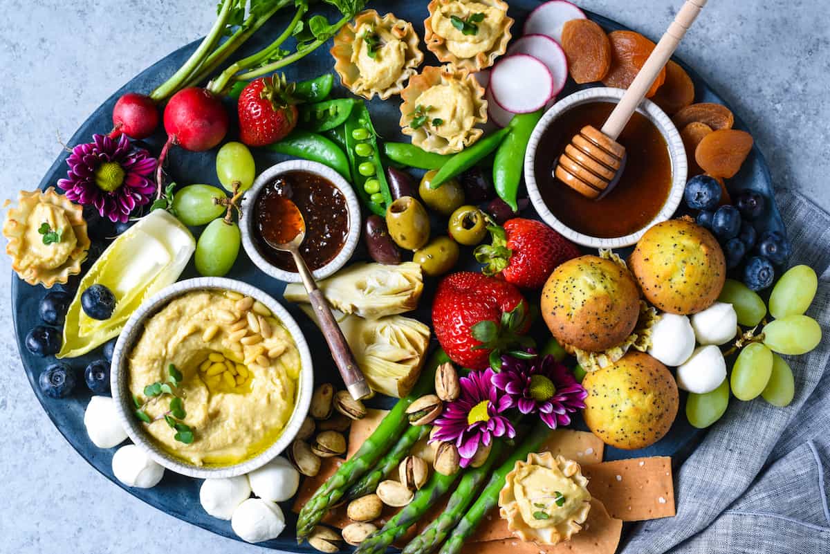 Spring Snack Platter with Hummus Phyllo Bites - A fresh, satisfying unofficial meal filled with seasonal produce and fun goodies. | foxeslovelemons.com