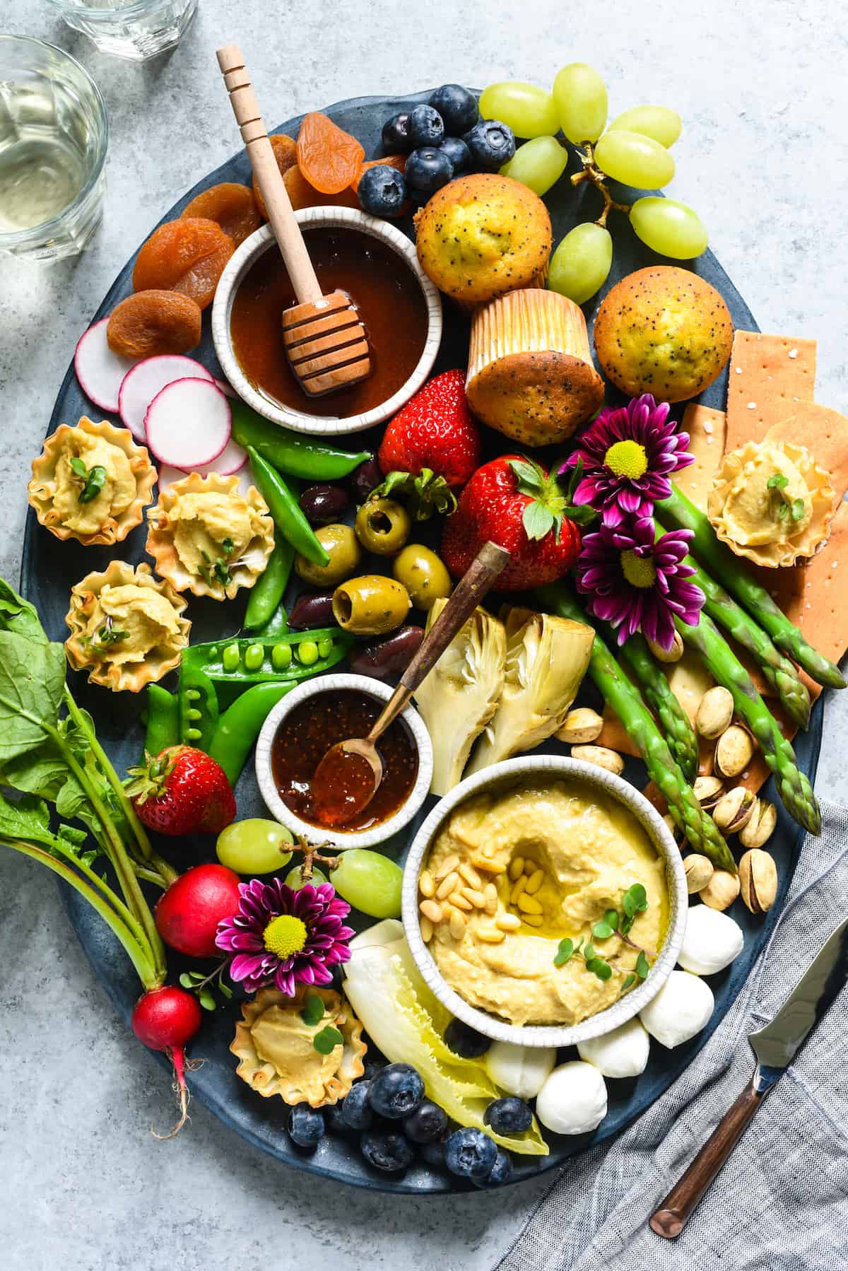 Spring Snack Platter with Hummus Phyllo Bites - A fresh, satisfying unofficial meal filled with seasonal produce and fun goodies. | foxeslovelemons.com