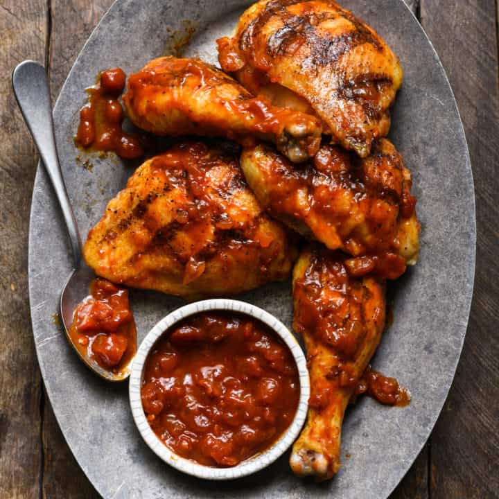 This Harissa Barbecue Chicken is an easy way to add a little spice to classic grilled chicken! | foxeslovelemons.com