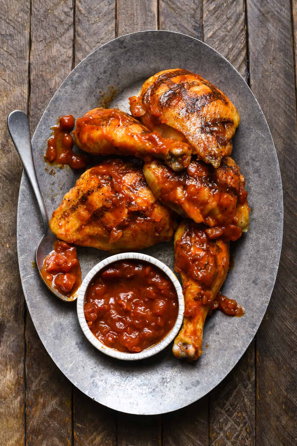 This Harissa Barbecue Chicken is an easy way to add a little spice to classic grilled chicken! | foxeslovelemons.com