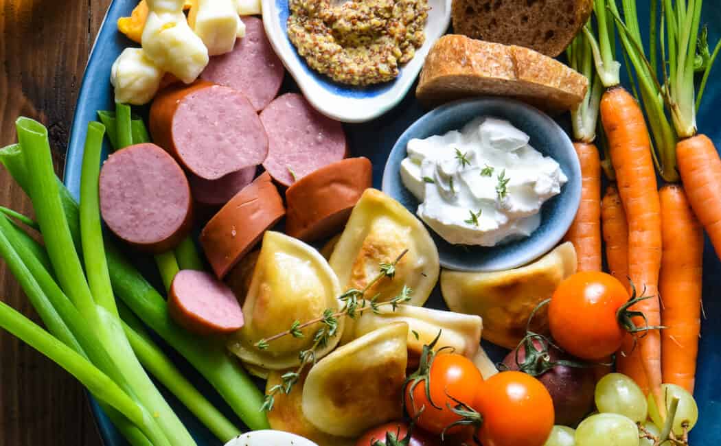 This Kielbasa & Pierogi Snack Dinner is a foolproof way to get the family gathered around the dinner table on a weeknight. There's something for everybody on this colorful platter! | foxeslovelemons.com