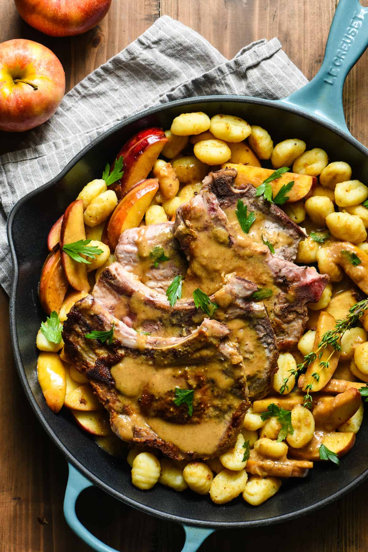Bring dinner to the table in a single pan with this Skillet Pork Chops with Apple Gnocchi Sauté recipe. Glaze everything with a hard cider sauce (or sub traditional apple cider) for a restaurant-quality meal that YOU can make at home on a weeknight. | foxeslovelemons.com