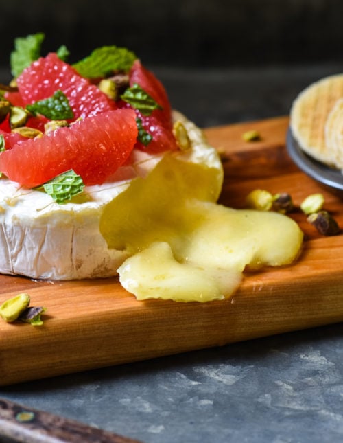With just 4 ingredients and a 10 minute prep time, this Easy Baked Brie with Grapefruit & Pistachios is ideal for a party, or just a delicious snack at home. | foxeslovelemons.com