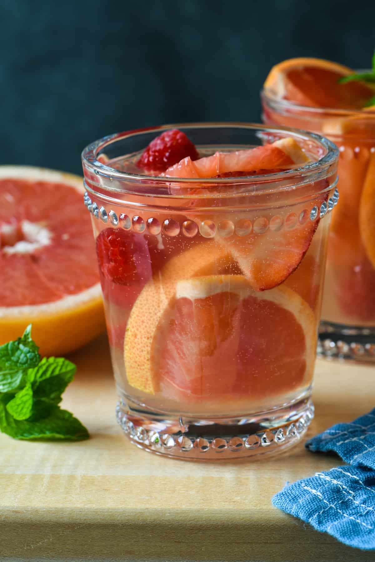 Grapefruit Sangria + 11 Grapefruit Recipes to Brighten Your Winter - Bring some happy flavor to a cold day with an appetizer, cocktail, breakfast, salad, lunch or dinner celebrating juicy, sweet grapefruit! | foxeslovelemons.com
