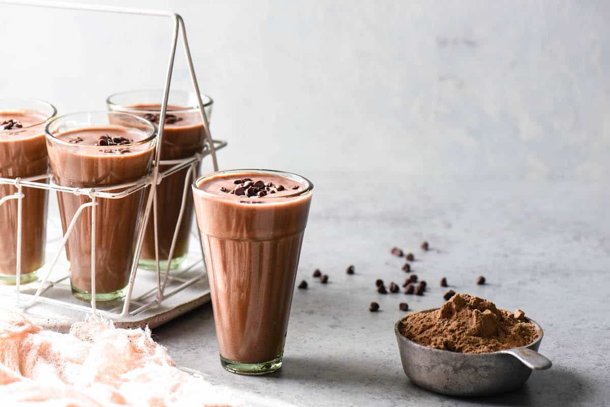 Blend up this High Protein Cocoa Smoothie for an energizing breakfast, or recovery after a workout. Fruity and full of chocolate flavor, it feels decadent while still being good for you!  | foxeslovelemons.com