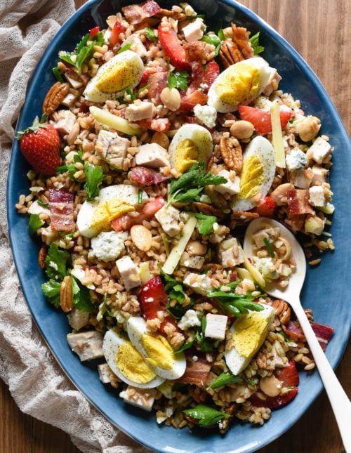 For this Really Good Farro Salad, start with a base of healthful whole grain farro, and top with all of your favorite salad ingredients. Easy, filling and so tasty! | foxeslovelemons.com