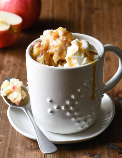 Craving a sweet treat but don't want to spend a lot of time in the kitchen? Use pantry ingredients and this Caramel Apple Mug Cake recipe to make two perfect portions of cake in your microwave. | foxeslovelemons.com