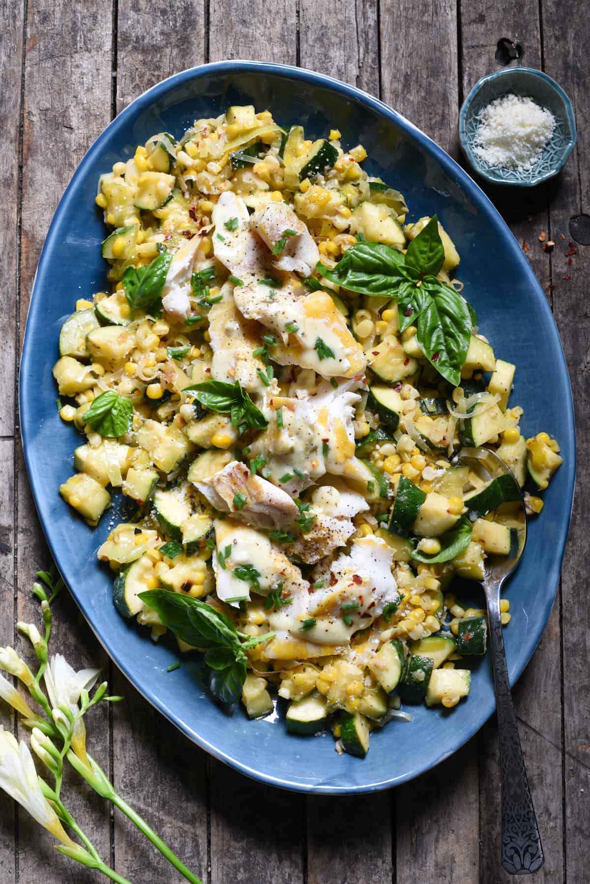 Summer is served on a platter in this Parmesan Corn & Zucchini Sauté with Haddock recipe. Learn how to make a fast, easy vegetable sauté that you'll come back to again and again all summer long. Top it with fish or your favorite protein to make it a complete meal! | foxeslovelemons.com