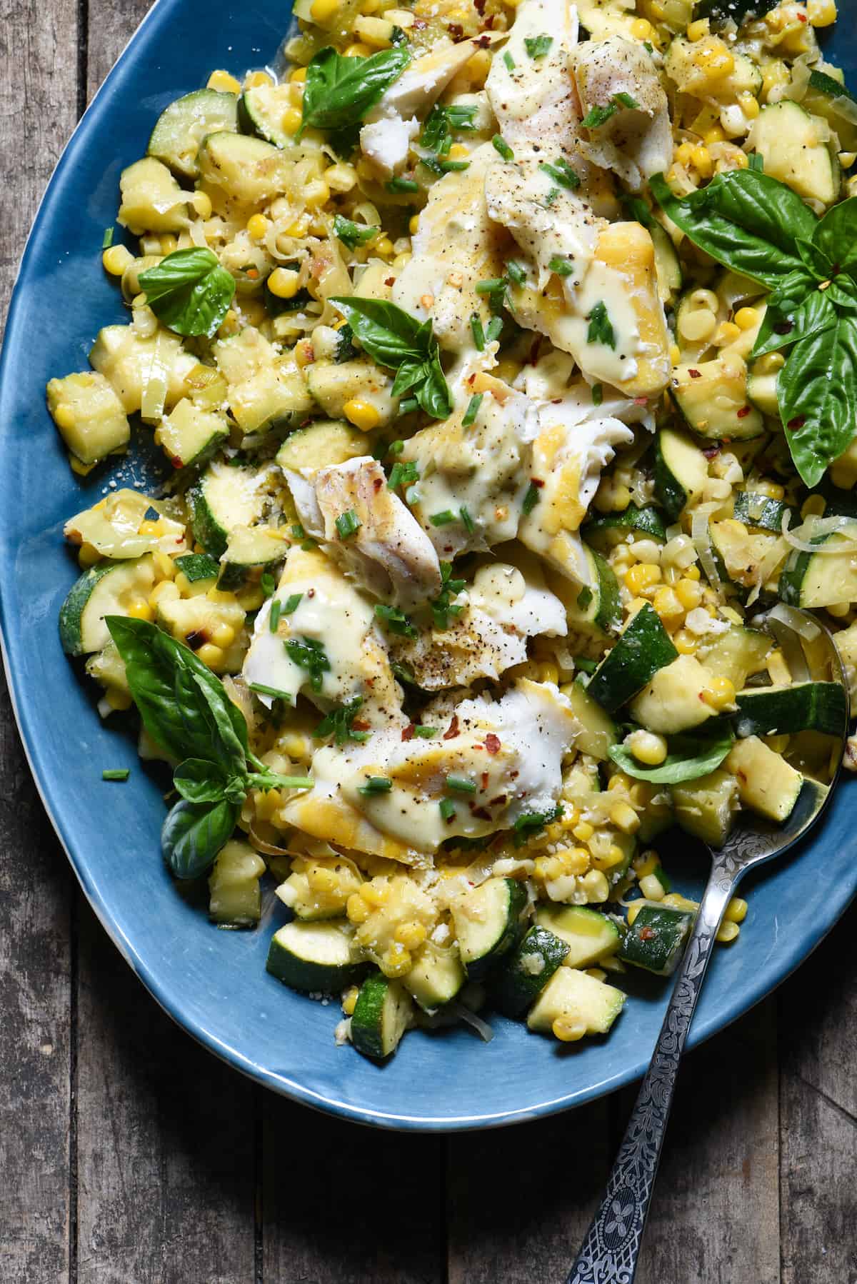 Summer is served on a platter in this Parmesan Corn & Zucchini Sauté with Haddock recipe. Learn how to make a fast, easy vegetable sauté that you'll come back to again and again all summer long. Top it with fish or your favorite protein to make it a complete meal! | foxeslovelemons.com