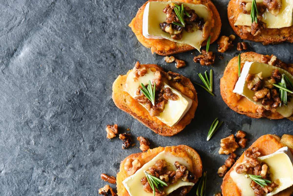 Impress your guests this holiday season with these Pumpkin & Brie Crostini with Candied Nuts. They look totally fancy, but they're 100% achievable for home cooks of all levels! | foxeslovelemons.com