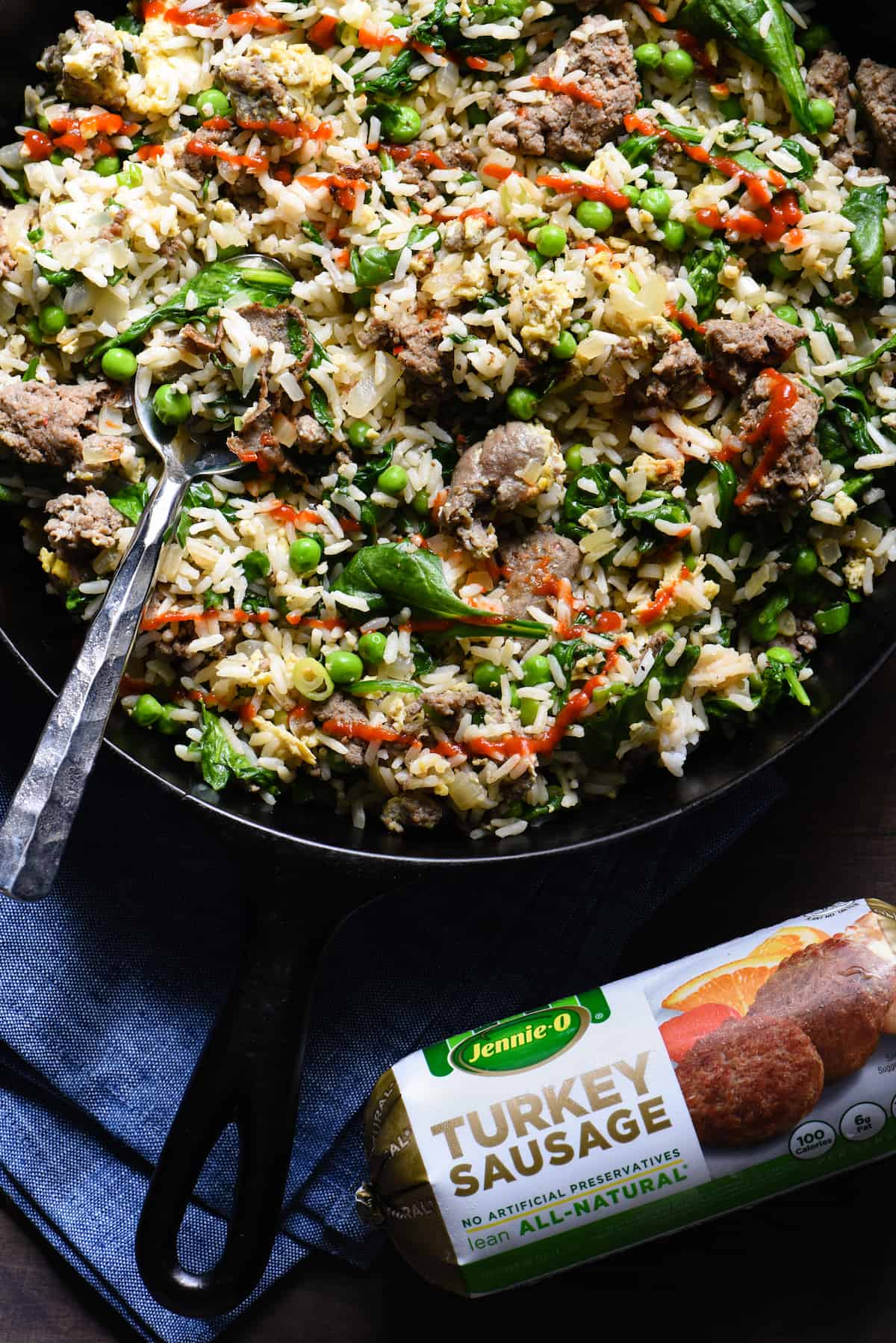 Break out a big cast iron skillet and feed a crowd with this Breakfast Fried Rice. Full of lean turkey sausage, eggs and lots of veggies, this will keep the crew fueled all morning. | foxeslovelemons.com
