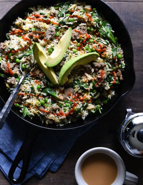 Break out a big cast iron skillet and feed a crowd with this Breakfast Fried Rice. Full of lean turkey sausage, eggs and lots of veggies, this will keep the crew fueled all morning. | foxeslovelemons.com