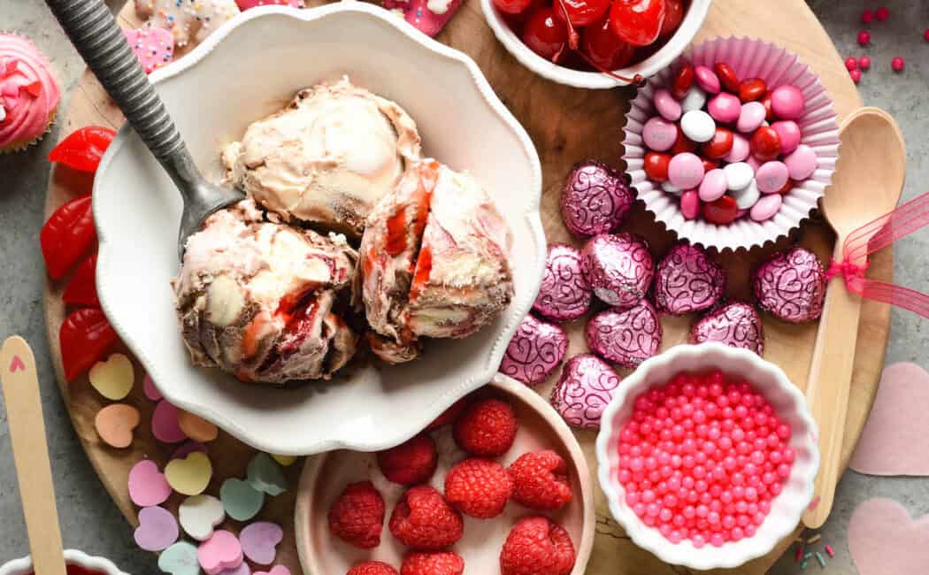 Make the holiday extra sweet with this dreamy Valentine's Day Dessert Board featuring ice cream, fruit, candies, chocolate and sprinkles! | foxeslovelemons.com