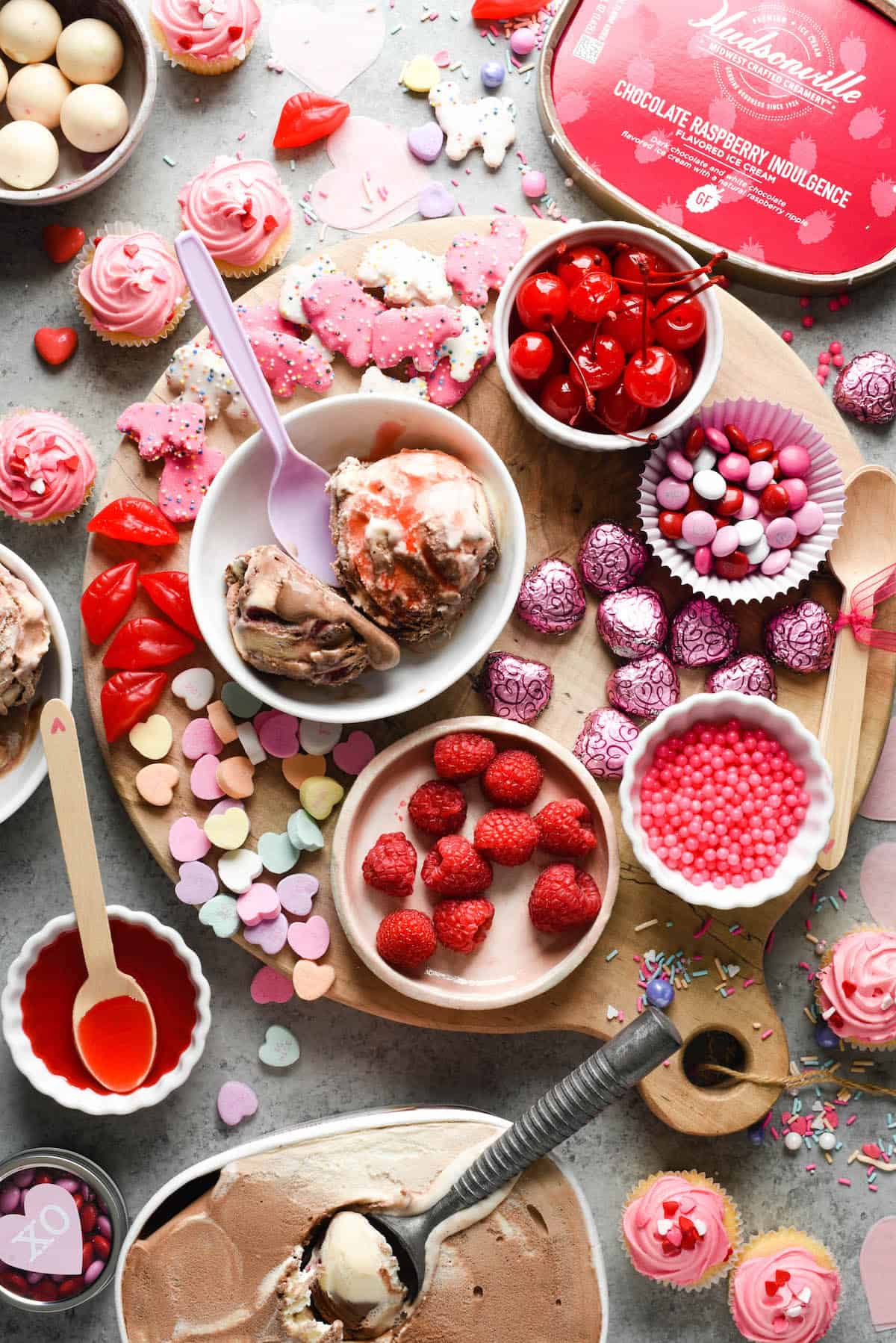 Make the holiday extra sweet with this dreamy Valentine's Day Dessert Board featuring ice cream, fruit, candies, chocolate and sprinkles! | foxeslovelemons.com
