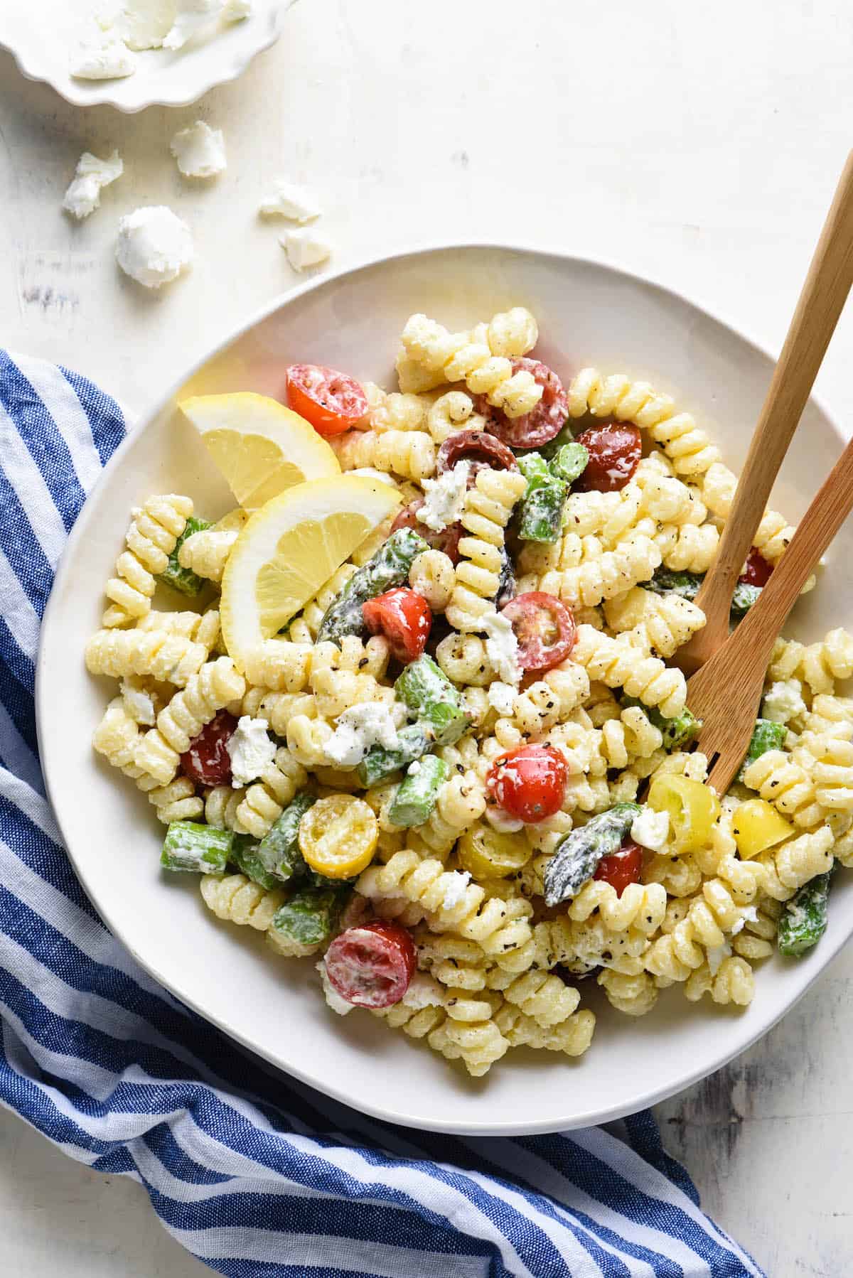 This creamy goat cheese pasta salad is simple to put together and will become a family favorite! Customize with any vegetables you like. | foxeslovelemons.com