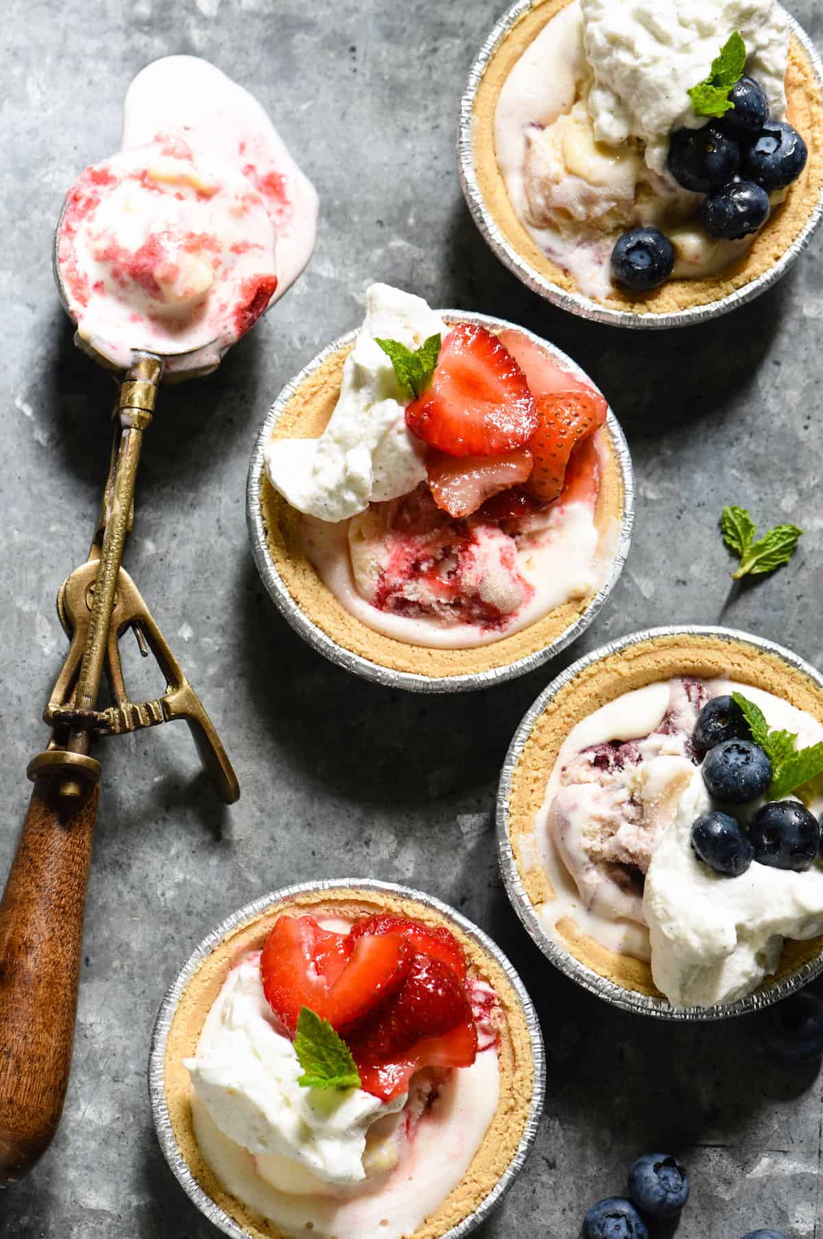 Celebrate summer's sweeter moments with Mini Ice Cream Pies. They take just minutes to put together, and there's no dishes to clean up once they're served! | foxeslovelemons.com