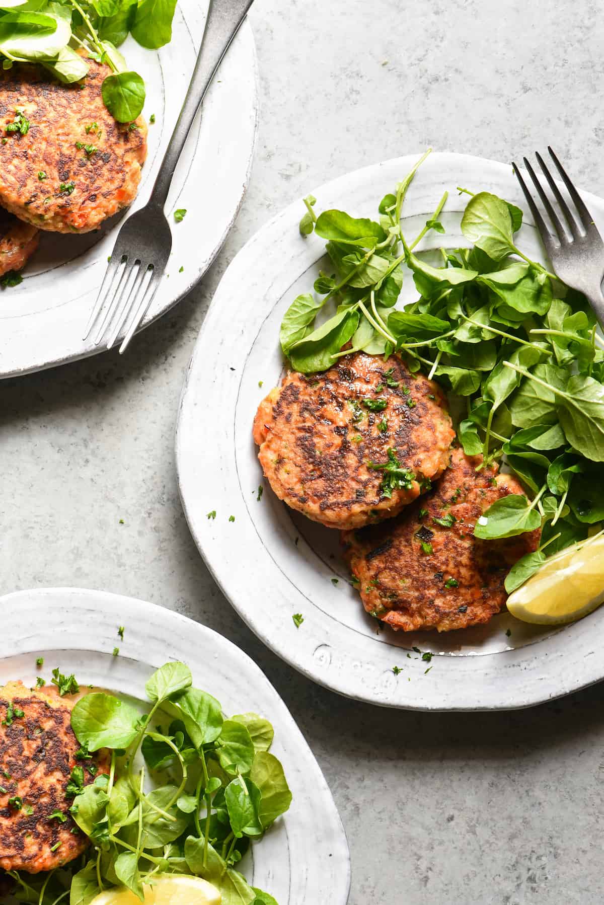 These Salmon Cakes are made with fresh, flavorful ingredients and are easy to prepare. This restaurant-quality recipe will win over even the seafood skeptics in your family. | foxeslovelemons.com