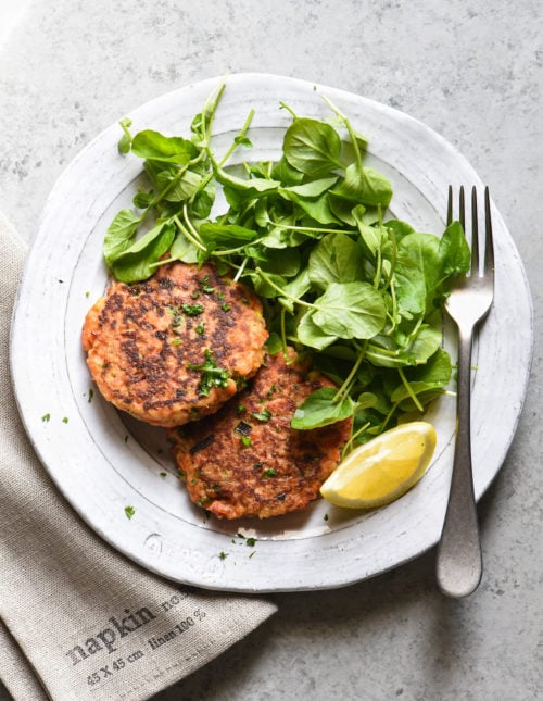 These Salmon Cakes are made with fresh, flavorful ingredients and are easy to prepare. This restaurant-quality recipe will win over even the seafood skeptics in your family. | foxeslovelemons.com