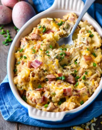 This Twice Baked Potato Casserole recipe is a perfect holiday side dish, but easy enough to make anytime. Smashed potatoes are mixed with cheese and bacon for a comforting and delicious casserole. | foxeslovelemons.com