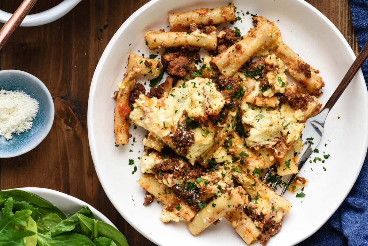 Bowl of pastitsio with fork.